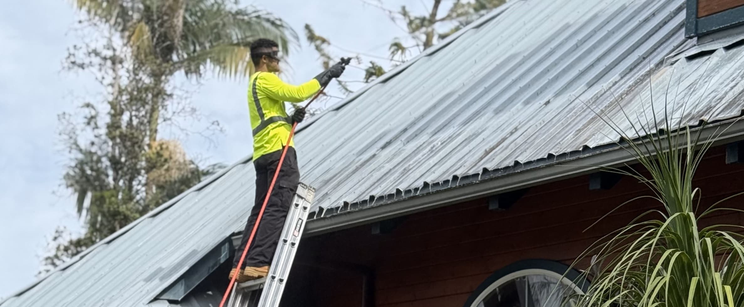 Roof soft washing service on Oahu Hawaii using a safe low-pressure cleaning process